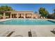 A community pool with chaise lounge chairs and shaded pergola at 3918 E Carson Rd, Phoenix, AZ 85042