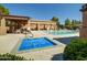 Community pool area featuring a covered hot tub and lounge chairs at 3918 E Carson Rd, Phoenix, AZ 85042