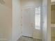 Bright entryway featuring a decorative front door, sidelight window, and tile flooring at 3918 E Carson Rd, Phoenix, AZ 85042