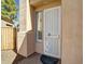 Close-up of front door with security screen, window, and desert-style landscaping at 3918 E Carson Rd, Phoenix, AZ 85042