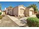Inviting single-story home with manicured landscaping, a two-car garage, and a tile roof at 3918 E Carson Rd, Phoenix, AZ 85042