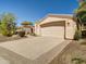 Single-story home with a two-car garage and low-maintenance desert landscaping at 3918 E Carson Rd, Phoenix, AZ 85042