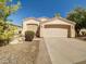 Charming single-story home featuring a two-car garage and desert landscaping at 3918 E Carson Rd, Phoenix, AZ 85042