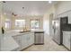 Open kitchen featuring a breakfast bar with stainless steel appliances at 3918 E Carson Rd, Phoenix, AZ 85042