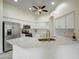 Bright kitchen with white cabinets, stainless steel appliances, and a spacious breakfast bar at 3918 E Carson Rd, Phoenix, AZ 85042