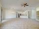 Bright, open floor plan with modern lighting, connecting living area to the kitchen at 3918 E Carson Rd, Phoenix, AZ 85042