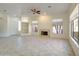 Bright living room with tile flooring, a fireplace, and ample space for entertaining at 3918 E Carson Rd, Phoenix, AZ 85042