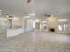 Spacious living room with modern lighting, fireplace, and tiled flooring at 3918 E Carson Rd, Phoenix, AZ 85042