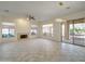 Large living room featuring neutral tile flooring, a fireplace, and access to the backyard at 3918 E Carson Rd, Phoenix, AZ 85042