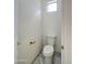 Bright toilet with a small window at 3918 E Carson Rd, Phoenix, AZ 85042