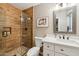 Bathroom features a tiled shower, mirror, and quartz counter at 4130 N 4Th Ave, Phoenix, AZ 85013