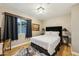 Bedroom featuring wood floors, black accents, and natural light at 4130 N 4Th Ave, Phoenix, AZ 85013