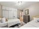 Bedroom featuring two beds, a dresser, overhead lighting and direct access to an ensuite at 4130 N 4Th Ave, Phoenix, AZ 85013