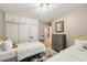 Bedroom featuring two beds, a dresser, overhead lighting and direct access to an ensuite at 4130 N 4Th Ave, Phoenix, AZ 85013