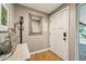 Entryway featuring a coat rack, a marble-topped accent table, and modern wood flooring at 4130 N 4Th Ave, Phoenix, AZ 85013