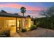 Inviting home exterior featuring a stone accent wall and decorative lighting at 4130 N 4Th Ave, Phoenix, AZ 85013