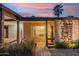 Inviting home exterior with a stone accent wall and covered walkway at 4130 N 4Th Ave, Phoenix, AZ 85013