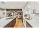 Modern kitchen island featuring gas cooktop and views to the living room at 4130 N 4Th Ave, Phoenix, AZ 85013