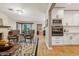 Open-concept living room featuring a fireplace, modern appliances, and hardwood floors at 4130 N 4Th Ave, Phoenix, AZ 85013