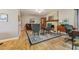 Inviting living room with a stone fireplace, wood flooring, and tufted armchairs at 4130 N 4Th Ave, Phoenix, AZ 85013