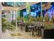 Inviting outdoor seating area with ambient lighting, potted plants, and comfortable seating arrangements at 4130 N 4Th Ave, Phoenix, AZ 85013