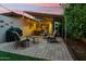 Outdoor patio featuring comfortable seating, a dining area, grill, and brick pavers, perfect for entertaining at 4130 N 4Th Ave, Phoenix, AZ 85013