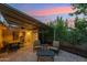 Outdoor patio featuring comfortable seating, a dining area, grill, and brick pavers, creating a relaxed ambiance at 4130 N 4Th Ave, Phoenix, AZ 85013
