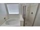 Bathroom featuring a bathtub and shower at 4908 N 110Th Dr, Phoenix, AZ 85037