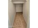 Walk-in closet featuring tile flooring and a shelf for organized storage at 4908 N 110Th Dr, Phoenix, AZ 85037