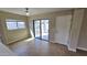 Eat-in kitchen featuring a view of a fenced backyard through sliding glass doors at 4908 N 110Th Dr, Phoenix, AZ 85037