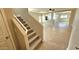 Bright entryway featuring a staircase, and views into the living room and kitchen at 4908 N 110Th Dr, Phoenix, AZ 85037