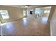 Spacious living room featuring tiled floors and lots of natural light from the windows at 4908 N 110Th Dr, Phoenix, AZ 85037