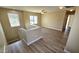 Upstairs loft area with wood-look flooring, abundant light and a ceiling fan at 4908 N 110Th Dr, Phoenix, AZ 85037