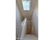 Well-lit staircase featuring neutral walls and wood-look flooring at 4908 N 110Th Dr, Phoenix, AZ 85037