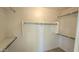 Spacious walk-in closet offering ample storage with rods and shelves at 4908 N 110Th Dr, Phoenix, AZ 85037