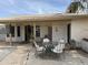 Covered back porch with outdoor seating, great for enjoying the backyard view and entertaining guests at 5430 N 74Th Ave, Glendale, AZ 85303