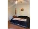 This bedroom features a ceiling fan, natural lighting, and ample closet space at 5430 N 74Th Ave, Glendale, AZ 85303