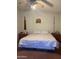Cozy bedroom featuring a ceiling fan, and vintage furniture, exuding a charming, rustic atmosphere at 5430 N 74Th Ave, Glendale, AZ 85303