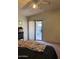 This bedroom offers a cozy retreat with a sliding glass door to the backyard at 5430 N 74Th Ave, Glendale, AZ 85303
