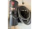 Garage featuring a mounted Hoover vacuum unit and hose for easy cleanup and maintenance at 5430 N 74Th Ave, Glendale, AZ 85303
