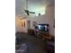 The living room features a ceiling fan, television, and cozy seating at 5430 N 74Th Ave, Glendale, AZ 85303