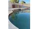 Sparkling pool with stone trim and a privacy wall, ideal for relaxing and entertaining outdoors at 5430 N 74Th Ave, Glendale, AZ 85303