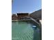 Swimming pool with water feature and pool cleaning robot; ideal for summer enjoyment at 5430 N 74Th Ave, Glendale, AZ 85303