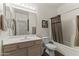 Bathroom featuring a bathtub with shower, light wood vanity, framed art, and sleek lighting at 5450 E Mclellan Rd # 102, Mesa, AZ 85205