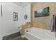 A bathroom featuring wood-look floors with a tub, toilet, and a separate shower at 5450 E Mclellan Rd # 102, Mesa, AZ 85205