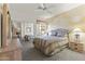 Cozy bedroom with decorative walls, mirrored closets, and a comfortable bed near a bright window at 5450 E Mclellan Rd # 102, Mesa, AZ 85205