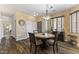 Cozy dining area featuring a round table with chairs, a sideboard and a bright window at 5450 E Mclellan Rd # 102, Mesa, AZ 85205
