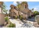 Beautiful exterior view of a two-story condo featuring well-maintained landscaping and a pathway at 5450 E Mclellan Rd # 102, Mesa, AZ 85205