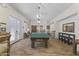 Inviting game room featuring a pool table, stylish decor, and comfortable seating for leisure activities at 5450 E Mclellan Rd # 102, Mesa, AZ 85205
