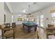 Spacious game room with pool table and seating, offering entertainment for residents and guests at 5450 E Mclellan Rd # 102, Mesa, AZ 85205